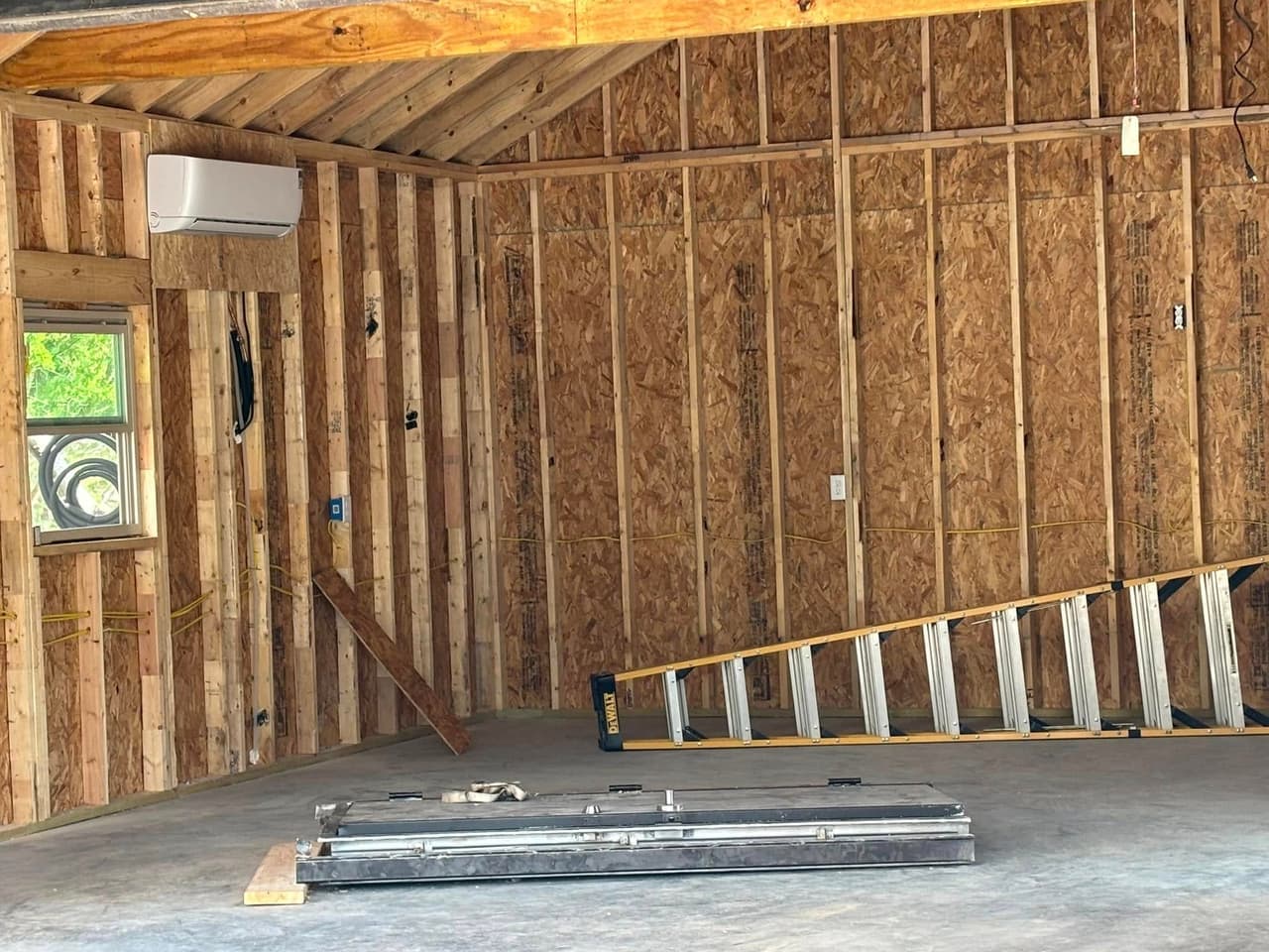 Interior remodel electrical rough-in wiring with exposed studs and outlet boxes in Hood County Texas