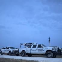 Twisted B Electric work trucks on jobsite in Granbury Texas